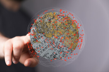 A hand interacts with a digital globe, showcasing interconnected data points and global network...