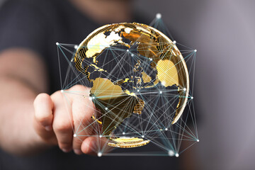 Hand interacting with a digital globe, symbolizing global connectivity and networking.