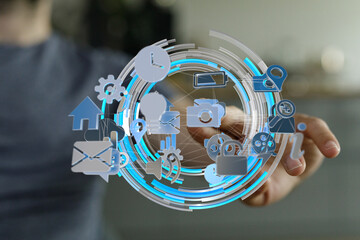 Person interacting with a digital interface showing various application icons.