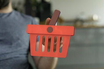 Person holding a red shopping cart icon.  E-commerce, online shopping concept.