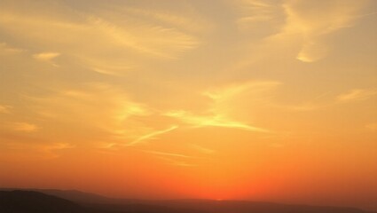 Obraz premium Beautiful Orange Sky at Sunset With Wispy Clouds