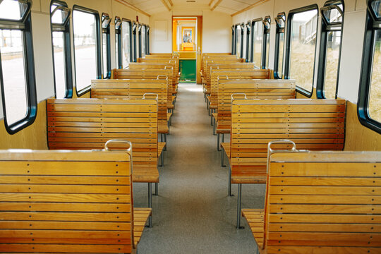 wooden benches in a train