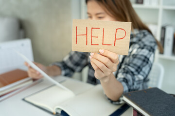 Asian student woman have anxiety because of exams, female hold help in the library. stress,...