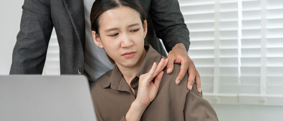 business man sexually harassed a female colleague by touch her shoulder. Sexual harassment in...