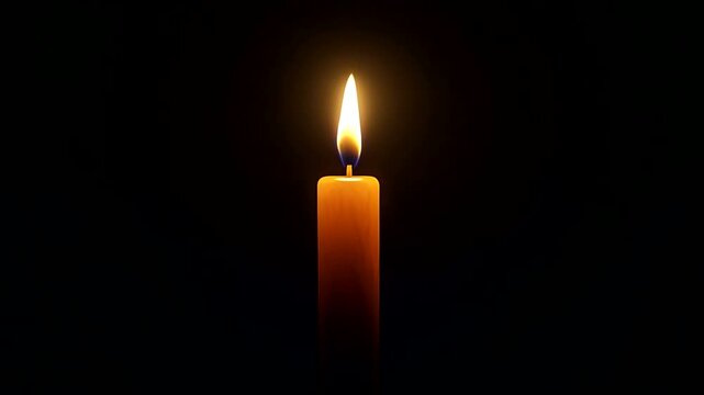 Single lit candle in dark background