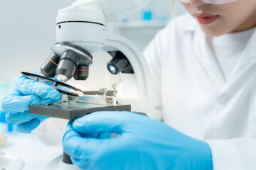 Scientist analyze biochemical samples in advanced scientific laboratory. Medical professional use...