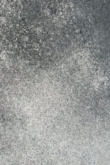 Surface texture showing concrete pattern with varied shades of gray and unique markings