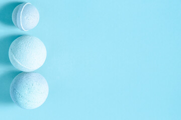 Bath bombs displayed on a blue surface for relaxation and self care activities