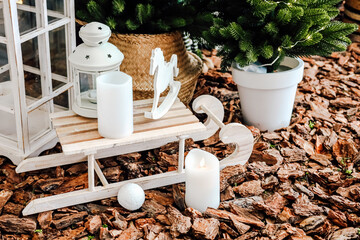 Decorative sled with candles and plants creating a cozy winter atmosphere
