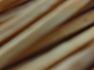 Abstract Blurred Bamboo Sticks Warm Tones and Diagonal Lines Texture.