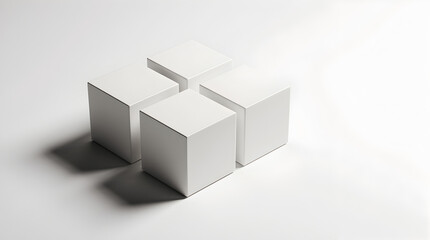 Fototapeta premium Four White Cubes Arranged in a Symmetrical Formation on a Clean White Surface, Ideal for Minimalist Design and Concept Visualization