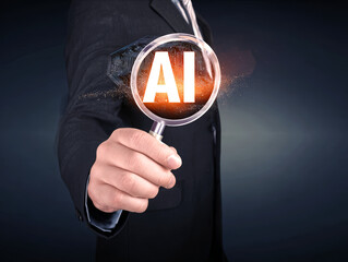 Business man hold a magnifying glass up to a AI artificial intelligence hologram.
