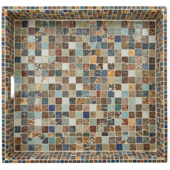 Fototapeta premium Colorful mosaic tile tray with intricate patterns, placed on a wooden surface