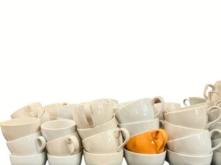 Coffee culture concept, stack of white with one orange ceramic coffee cups piled up with isolated...