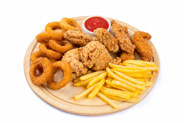 Chicken fillets, wings, onion rings and fries on white background