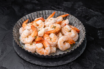 A plate of shrimp. The shrimp are arranged in a circular pattern, with some of them overlapping...