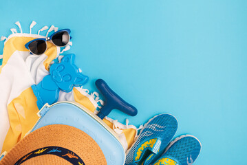 Children's beach essentials including a hat, sunglasses, water shoes, suitcase, and towel.