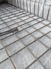 Iron frame construction project that will be cast in concrete.