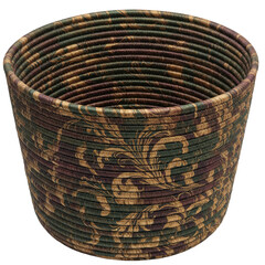 Decorative woven basket with intricate floral patterns, placed on a rustic wooden table