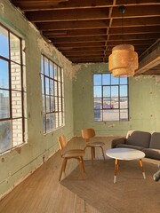 Vintage Industrial Lounge with Green Distressed Walls and Midcentury Furniture