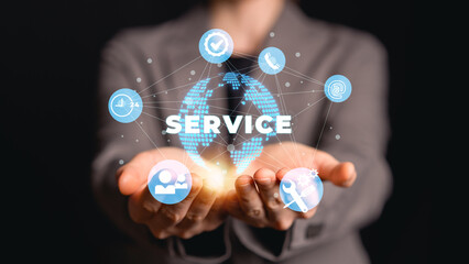 Fototapeta premium Businesswoman holding virtual global service network icons with customer support tools communication. Customer service and support solution, and 24 hour assistance concept