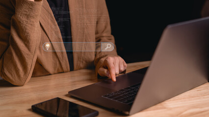 Businesswoman using laptop with virtual AI search bar interface displaying binary code and smart data analysis for intelligent information processing