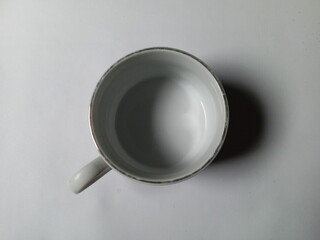 empty cup closeup on white background.