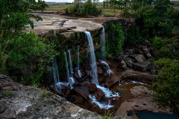 Majestic Phe Phe waterfall of Meghalaya, cascading over rocky cliffs,  surrounded by lush green...