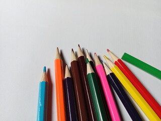 Colored pencils on a white background. Back to school, art drawing.