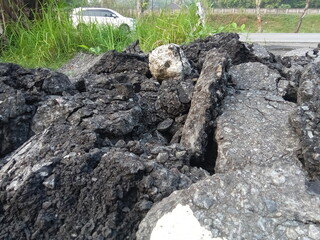 asphalt debris collected in vacant lots.