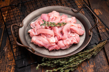 Sliced raw Chicken meat, Boneless and skinless  fillets on tray. wooden background