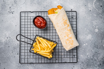 Seafood Doner kebab with shrimps, prawns, salad and french fry. grey background. top view