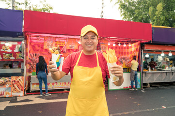 Portrait of a charismatic vendor selling his wares at a local fair in Latin America. The man is...