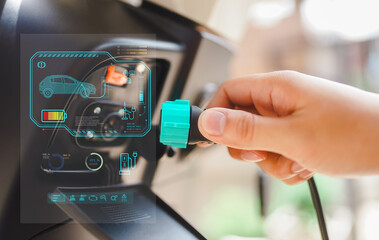Electric car battery charging at charge station 
