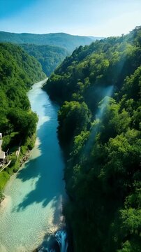 Scenic Aerial View of River and Waterfall in Mountainous Forest Landscape