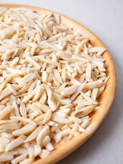 White Almond Stick set on wooden board and white background.