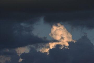 White cloud among dark thunderclouds