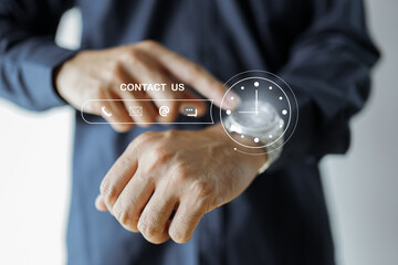 Contact us or Customer support hotline people connect. Businessman using a laptop and touching on virtual screen contact icons. Contact Us Customer Support Inquiry Hotline Concept.
