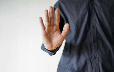 Social victim man with problems hiding face with hand 
