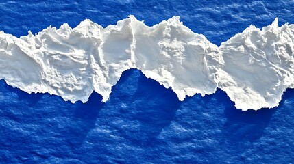 White torn paper on a deep blue surface