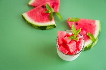 Red juicy watermelon and morning yogurt in a minimalist fruit composition