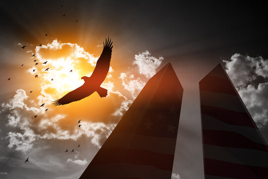 Silhouette of Towers with soaring eagle and flying birds on background of black and white sky. 09.11.2001 American Patriot Day banner.