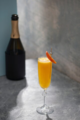 Summer alcohol drink peach bellini or mimosa in flute glasses. Brunch cocktail