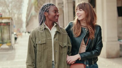 Young lesbians walking. gay, friends or lesbian couple enjoy the time together. Dating, trust and support with female and her girlfriend on holiday, vacation or travel