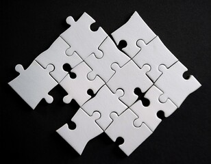 closeup of incomplete white puzzle pieces on black background symbolizing challenge and problem solving