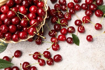 Fresh ripe cherries on light table, flat lay