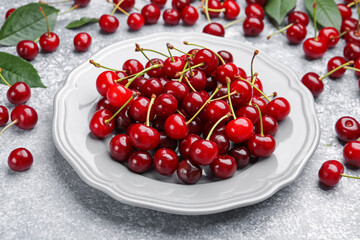 Fresh ripe cherries on light table, closeup