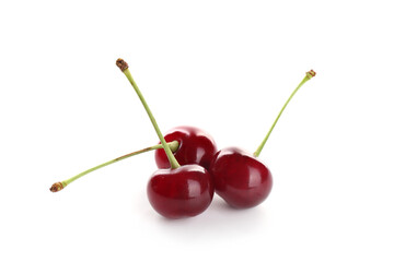 Three fresh ripe cherries isolated on white