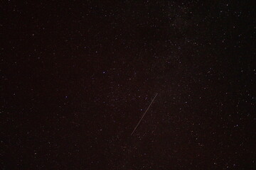 Beautiful shooting star and aurora borealis in the background