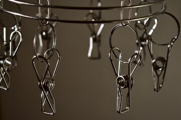 Metal clothespins for drying clothes indoors.